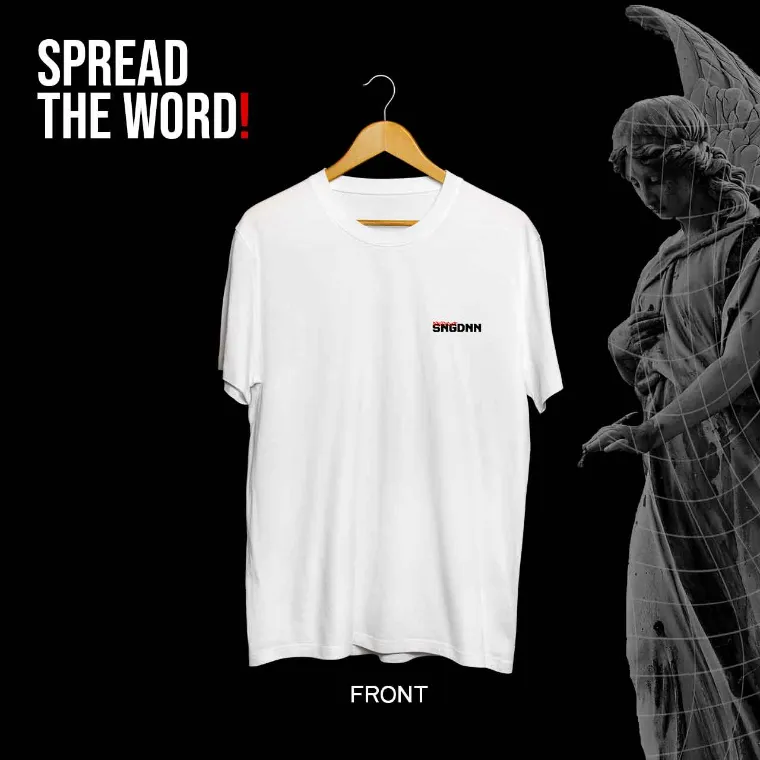 Front of a white tee with a small chest logo, beside an angel statue